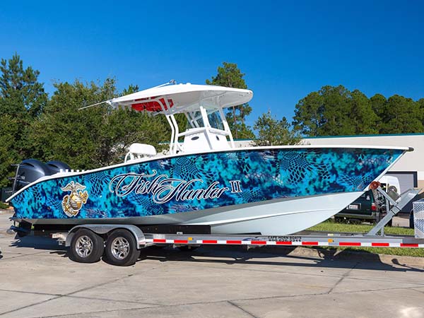 Vinyl wrap installation on a boat by Marine Wraps in Miami, offering a sleek, custom look.